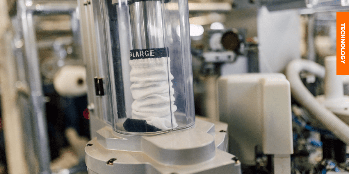 Leading Custom Sock Manufacturer in Africa A white blank sock during the manufacturing process, illustrating the superior base quality we use for all custom branding.